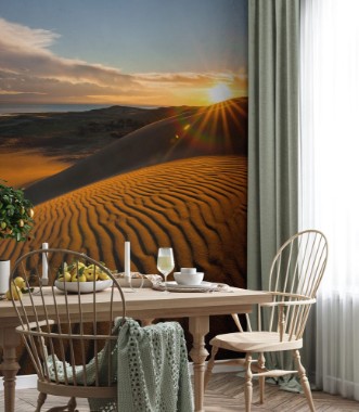 Afbeeldingen van Picturesque desert landscape with a golden sunset over the dunes