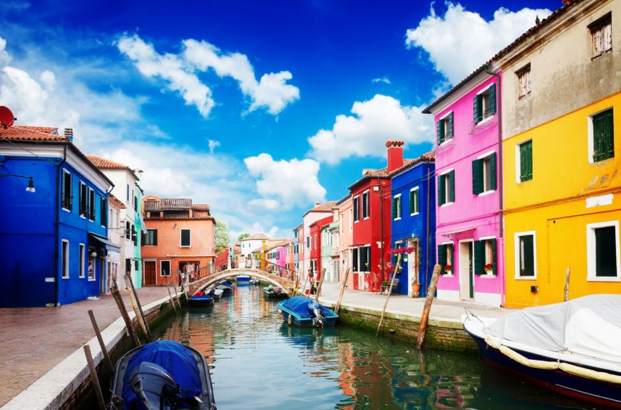 Picture of Multicolored houses over canal with boats street of Burano island Venice Italy retro toned