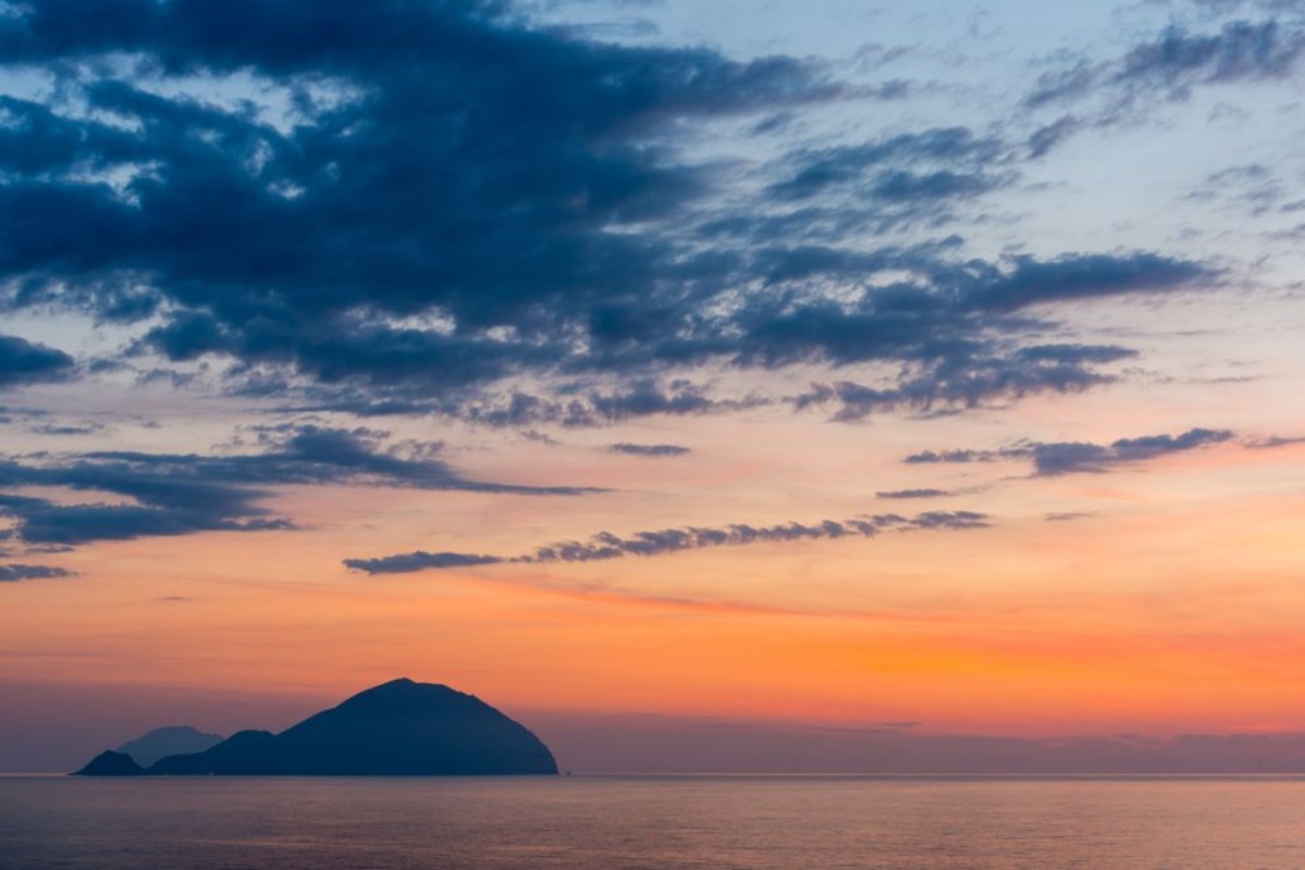 Bild på Beautiful colorful Filicudi and Alicudi eolian islands view at sunset in summer from Pollara in Salina island