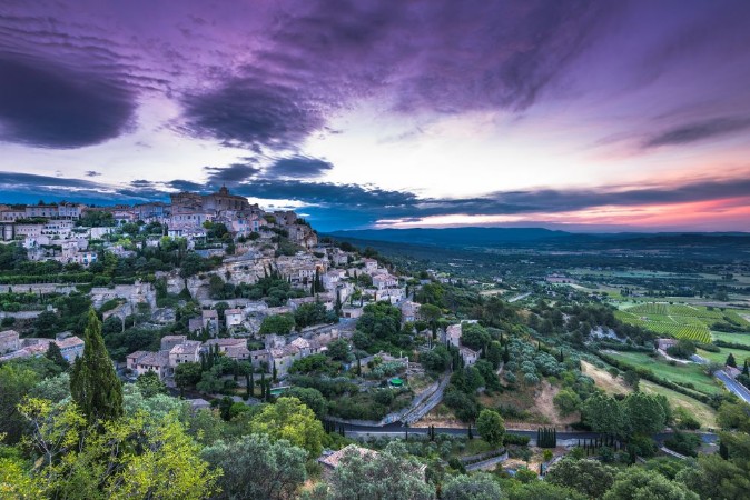 Picture of Rising sun over valley with Gordes town
