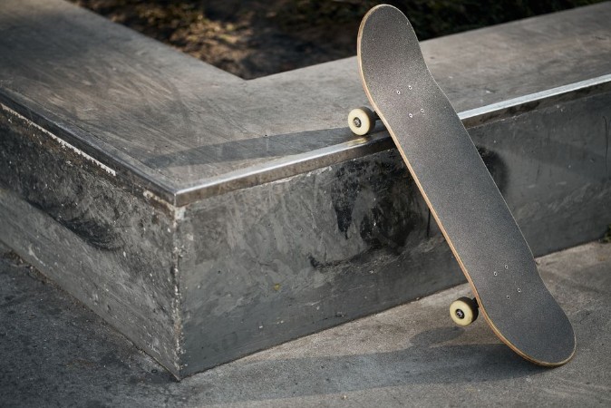 Picture of Black skateboard in concrete skatepark