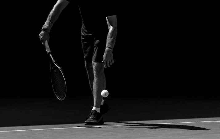 Tennis player in action photowallpaper Scandiwall