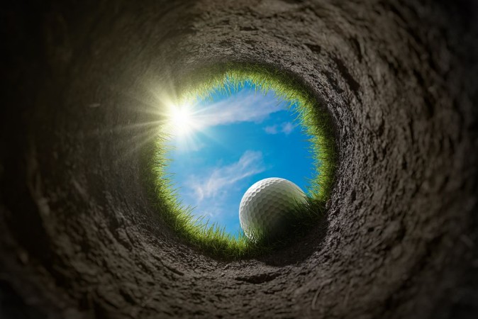 Picture of Golf Ball Falling Into Hole