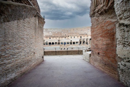 Bild på Colosseum in Rome with dark clouds