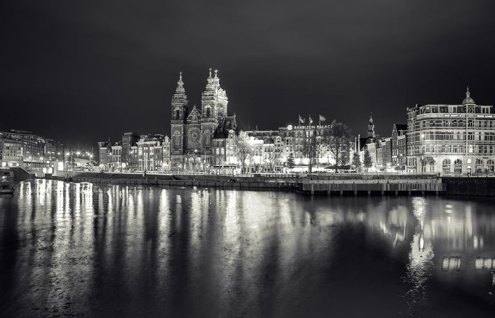 Picture of AMSTERDAM NETHERLANDS - MAY 25 2017 General view of Central station of Amsterdam city at night time Black-white photo May 25 2017 in Amsterdam - Netherlands