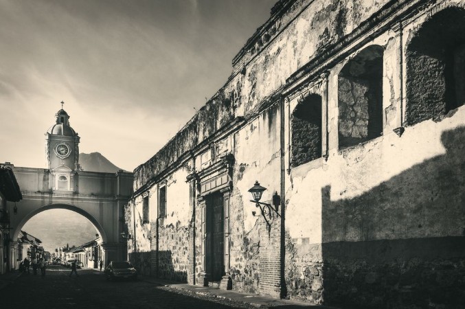 Picture of Vintage look of Santa Catalina Arch with a heritage ruin on the right and Agua Volcano in the background