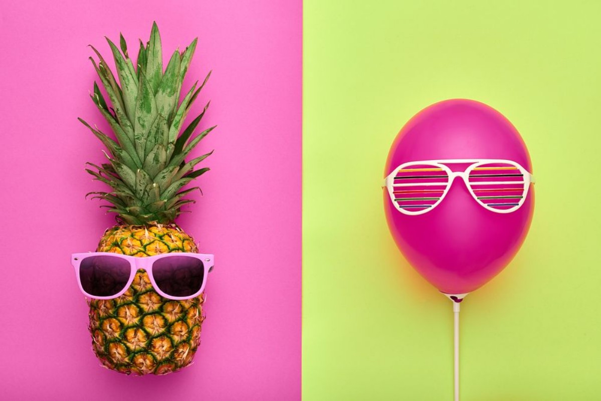 Picture of Pineapple and Pink air Balloon Bright Summer Color Accessories Tropical Hipster pineapple with Sunglasses Creative Art concept Minimal style Summer party background Fun
