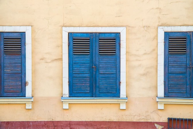 Picture of Closed windows with old blue shutters Part of the facade of the building in the old town Riga Latvia