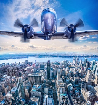 Image de Vintage airplane in the sky over manhattan