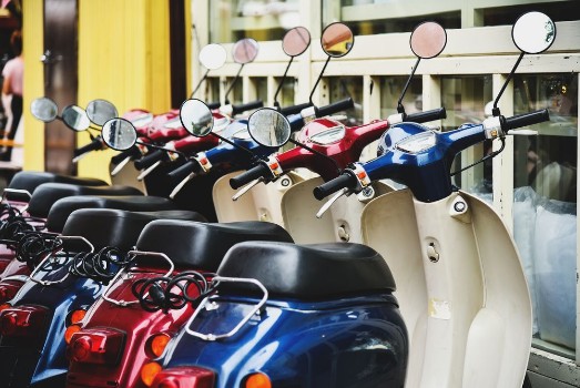 Picture of Retro Mopeds in the parking at the street cafe