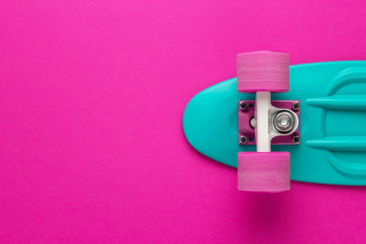 Image de Plastic mini cruiser board on deep pink with background with copy space