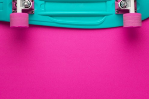 Afbeeldingen van Plastic mini cruiser board on deep pink with background with copy space
