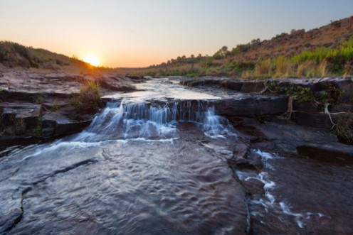 Picture of Small waterfall at sunset
