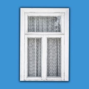 Bild på Old white paint wooden window isolated on blue