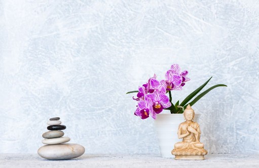 Picture of Buddha pyramid of pebbles and orchid flower as zen background