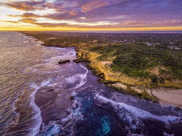 Image de Aerial view of rugged ocean coastline with rural houses in the distance at dusk Melbourne Australia