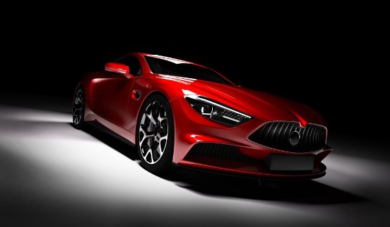 Image de Modern red sports car in a spotlight on a black background