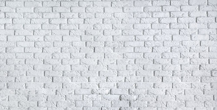 Picture of White brick wall home interior background horizontal photo banner for website design clean blank texture concrete cement pattern surface masonry brickwork header with copy free space for text
