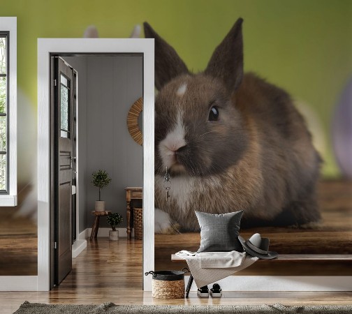 Bild på Bunny with Easter eggs on green background