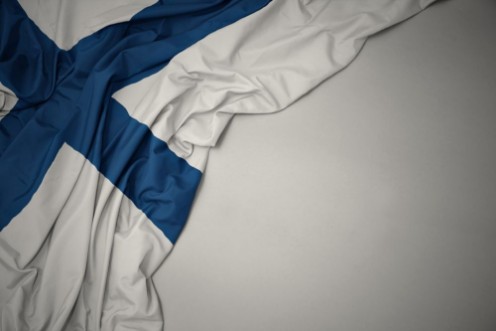 Afbeeldingen van Waving national flag of finland on a gray background
