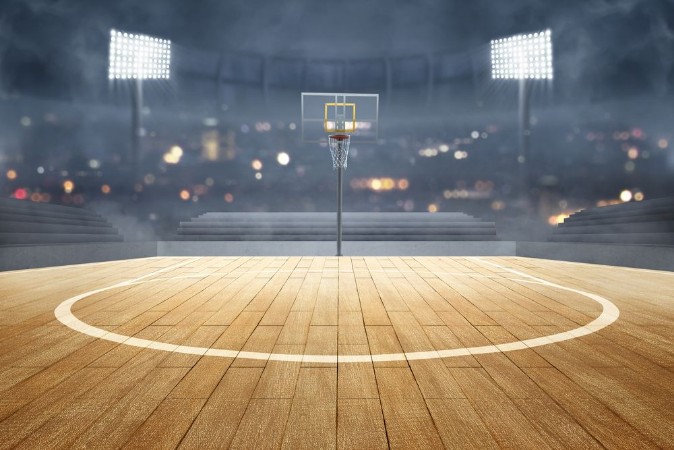 Afbeeldingen van Basketball court with wooden floor lights reflectors and tribune