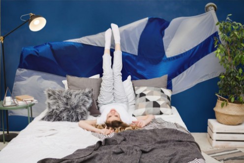 Afbeeldingen van Finnish national flag on the wind against the blue sky