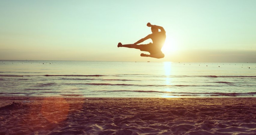 Picture of Flying kick on the beach