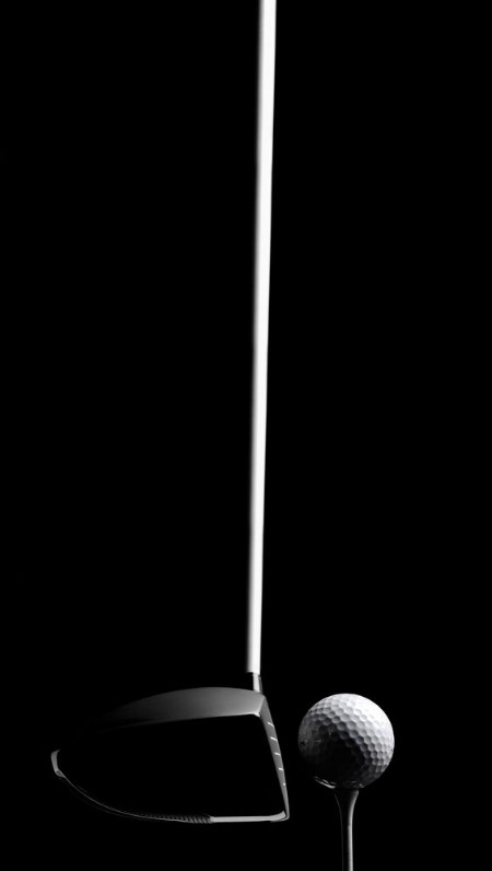Picture of Golf Wood with a Golf Ball and Golf Tee Isolated on Black