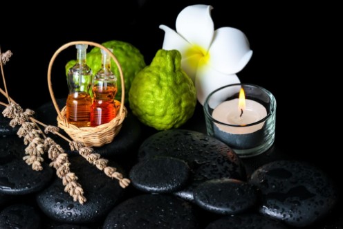 Bild på Aromatic spa concept of bottles essential oil bergamot fruits