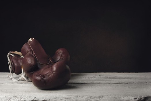 Picture of Boxing Gloves lying on wooden Planks
