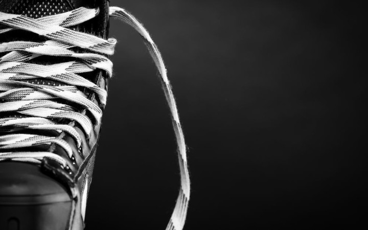 Picture of Half of a hockey skate on black