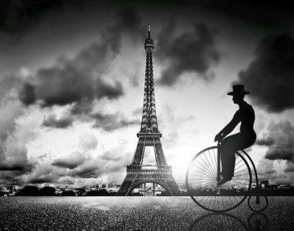 Picture of Man on retro bicycle next to Effel Tower Paris France