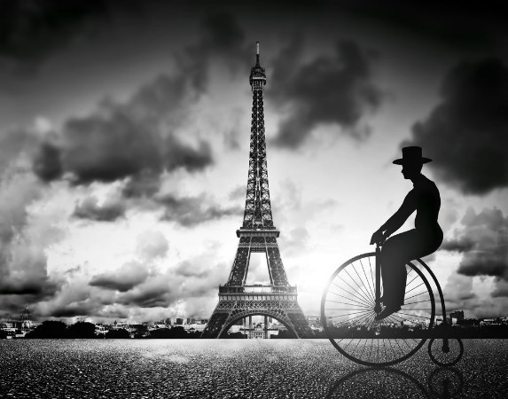 Picture of Man on retro bicycle next to Effel Tower Paris France