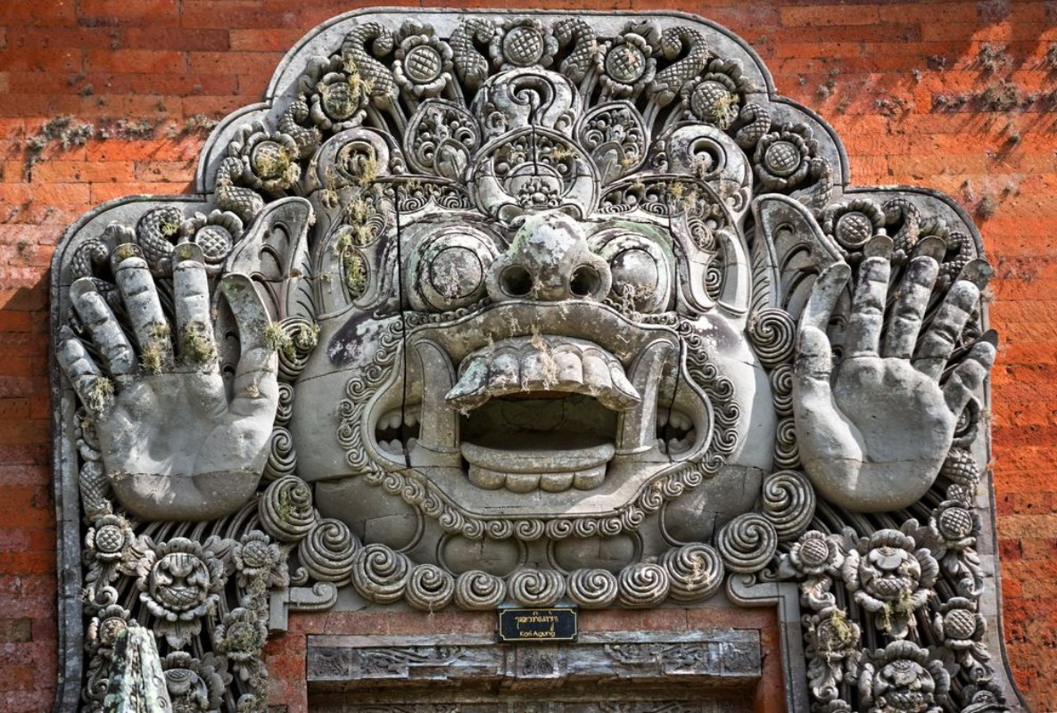 Bild på Carvings depicting demons or gods above the entrance to the temp