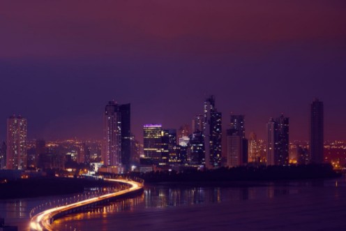 Afbeeldingen van Panama City Night Skyline With Car Traffic On Highway