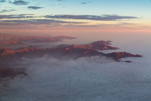 Bild på The Andes mountains rising out of a stratus cloudlayer