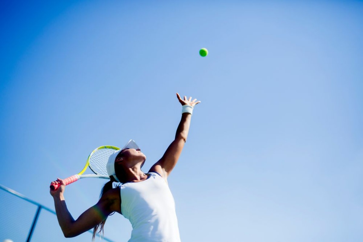 Bild på Beautiful female tennis player serving