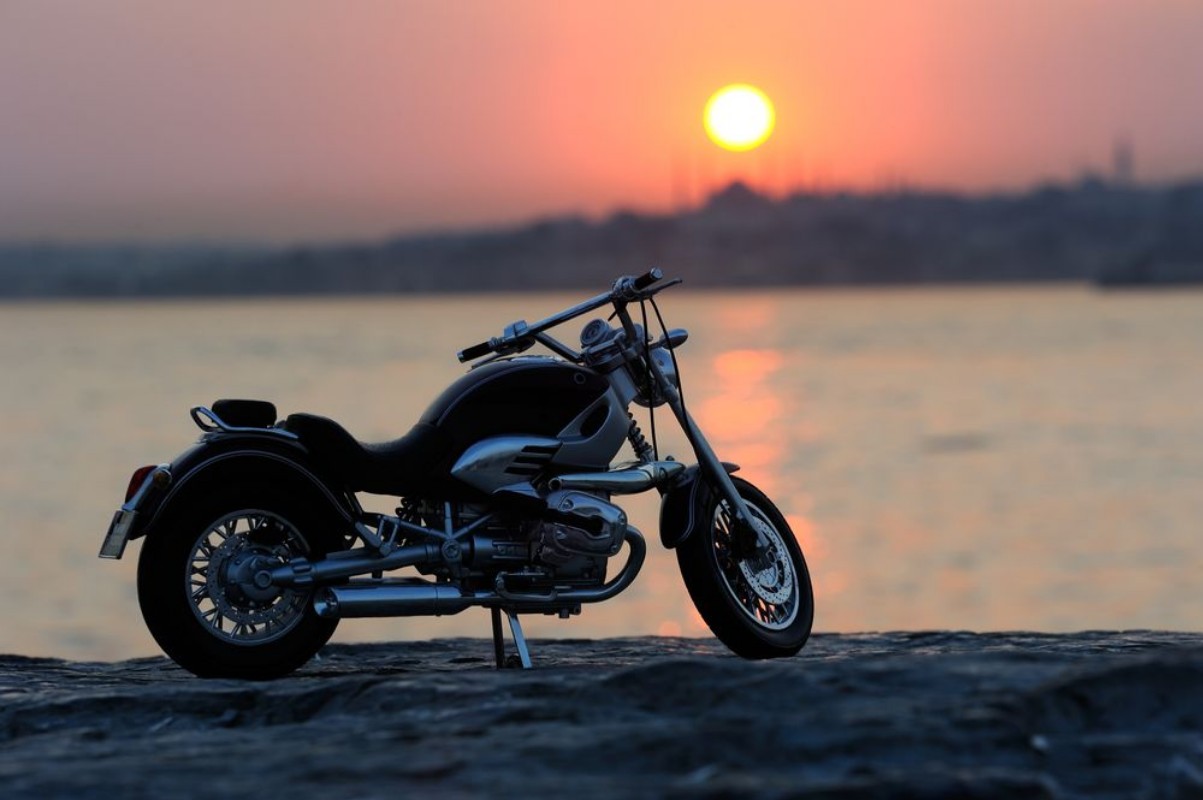 Picture of Motorcycle on the rocks in sunset and golden hours