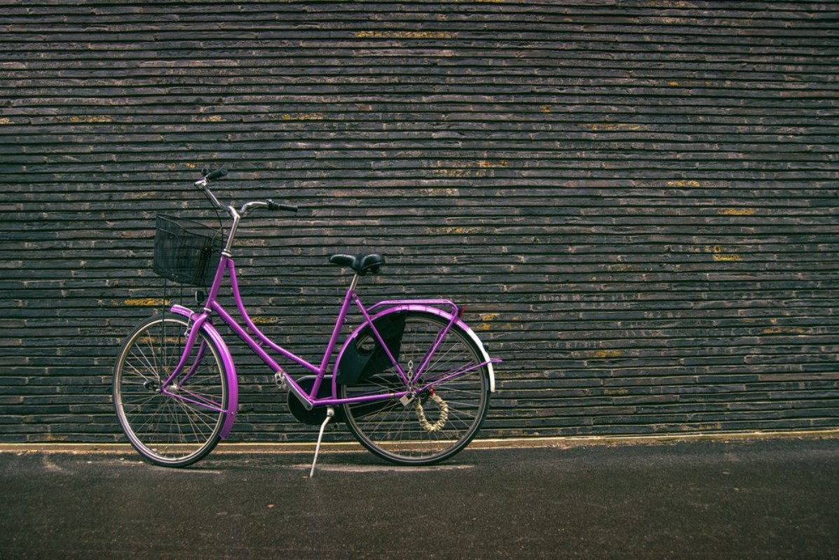 Picture of Classic Vintage Purple Hipster Bicycle on the Street