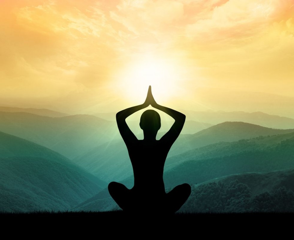Picture of Yoga and meditation Silhouette of man in moontains