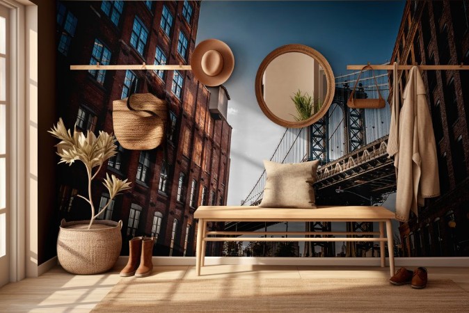 Picture of Manhattan bridge seen from a narrow alley enclosed by two brick buildings on a sunny day in summer