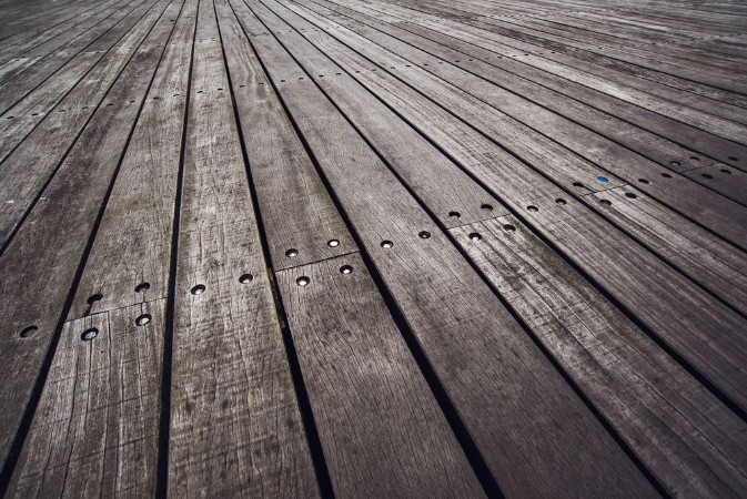 Bild på Rustic Wooden Floor Boardwalk in Perspective