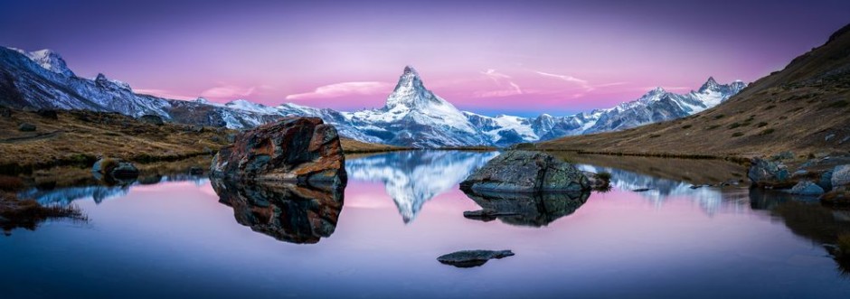 Bild på Stellisee in der Schweiz mit Matterhorn im Hintergrund Panorama