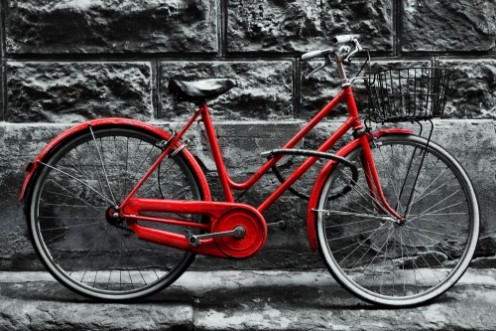 Afbeeldingen van Retro vintage red bike on black and white wall