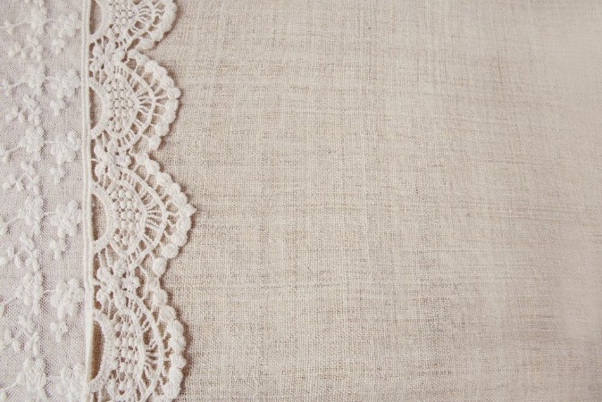 Picture of Lace on linen copy space background vintage tone