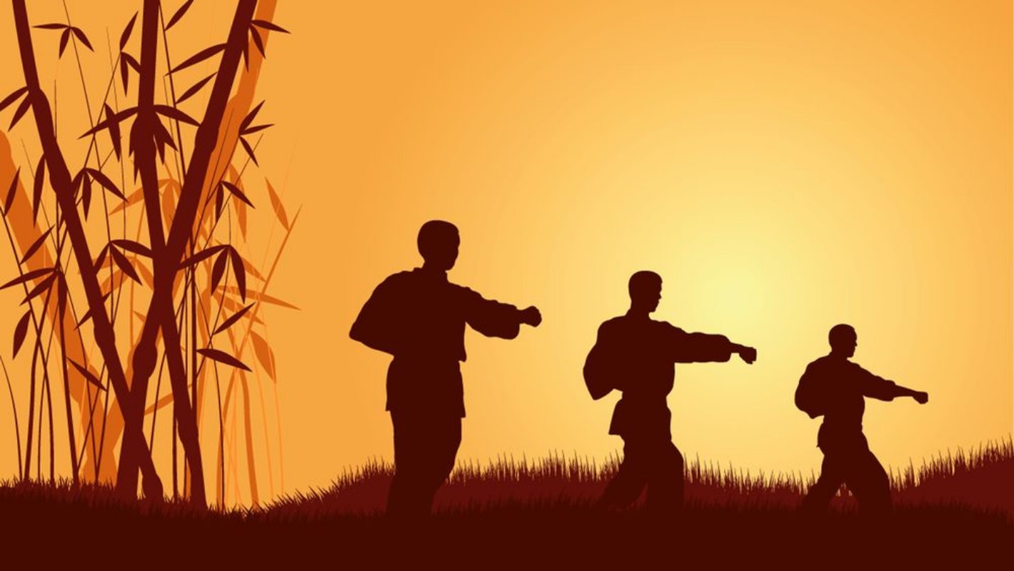 Afbeeldingen van Three men demonstrate Karate on a background a calling sun