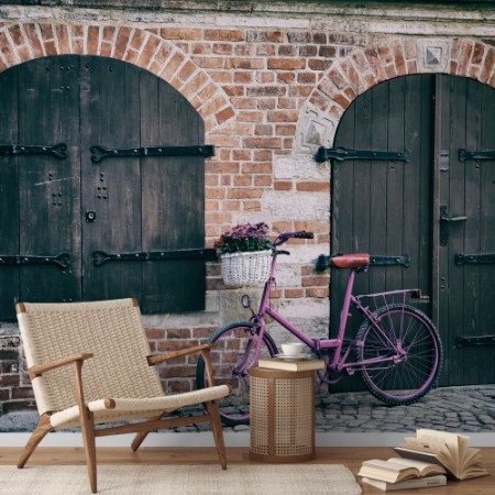 Pink bike standing by the wall photowallpaper Scandiwall