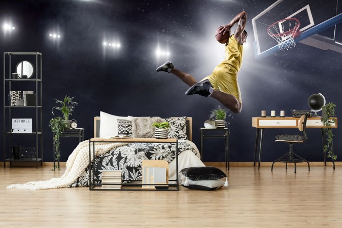 Basketball player makes slam dunk on big professional arena Player flies through the air with the ball Player wears unbranded clothes photowallpaper Scandiwall